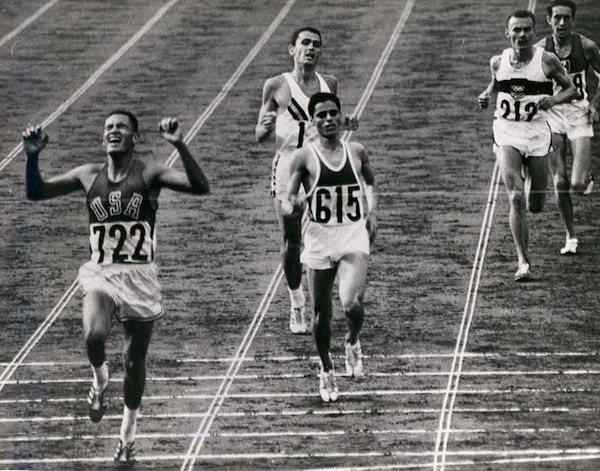 BillyMills_Crossing_Finish_Line_1964Olympics