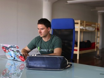 Buffer CEO Joel Gascoigne with bunk bed in office on transparency