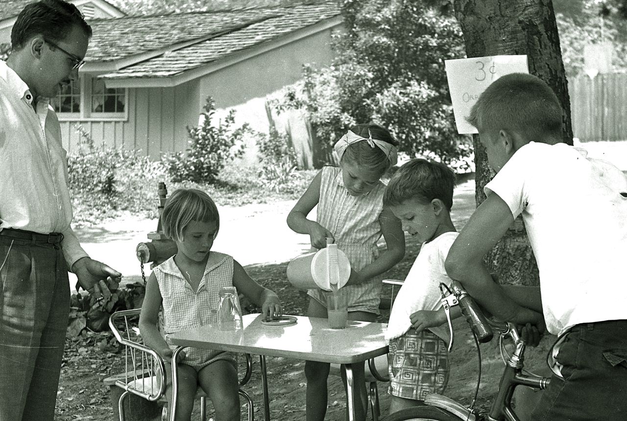 Children_selling_lemonade_to_an_adult_in_La_Canada,_California,_1960